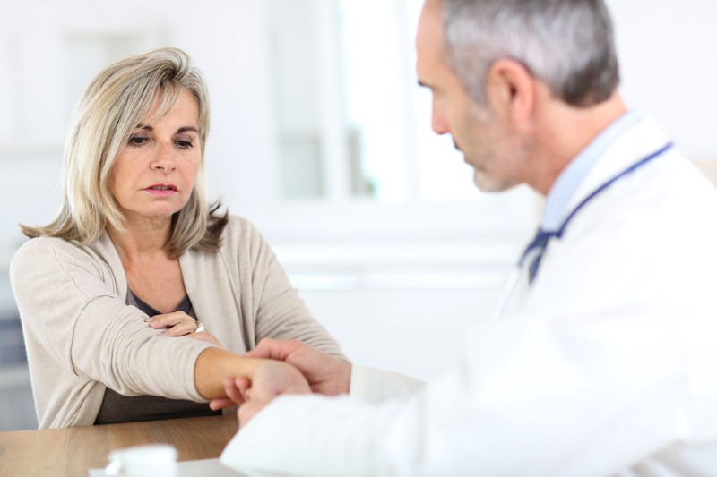 Patient with a chronic condition speaking with a medical doctor