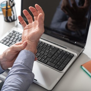 person with carpal tunnel syndrome from overuse