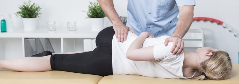 woman receiving a chiropractic adjustment